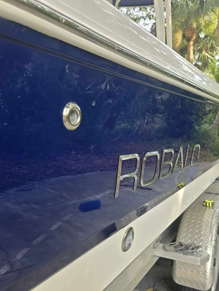 Glossy deep blue Robalo hull after detailing